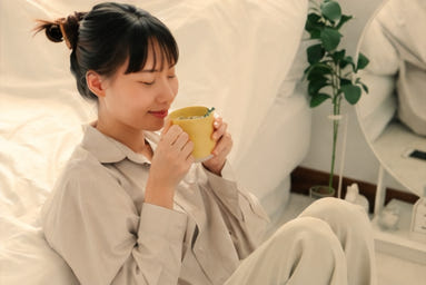 Woman enjoying a quiet cup of herbal tea